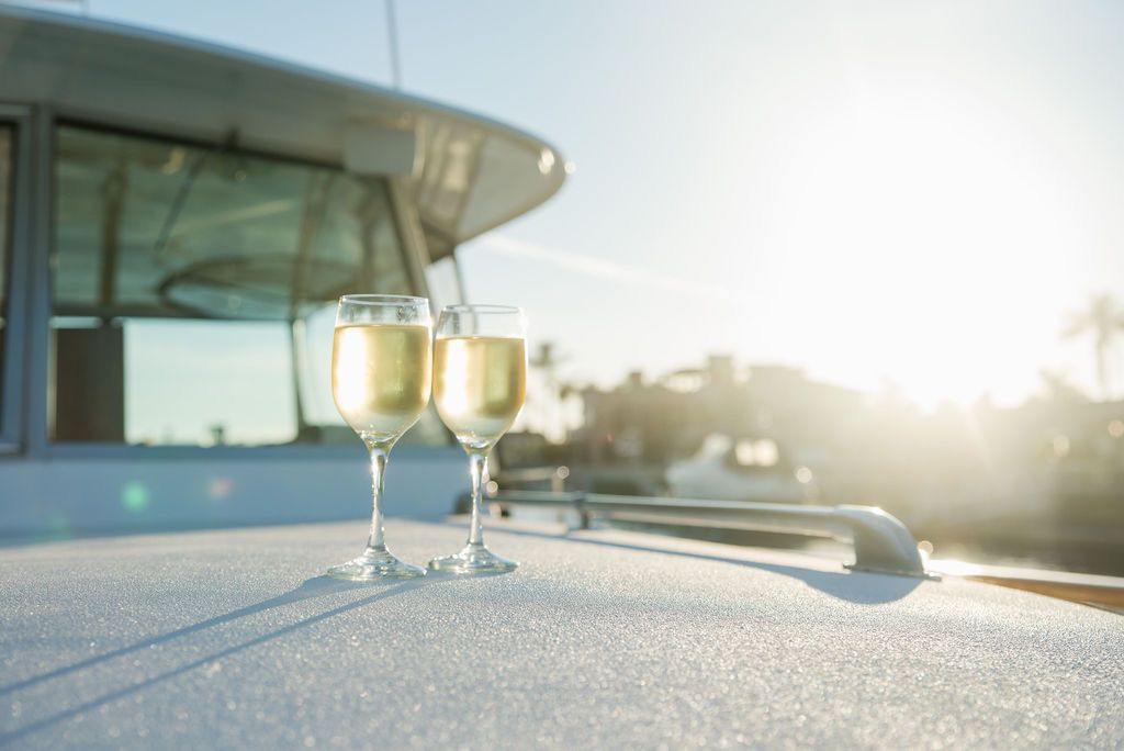 A sunset toast aboard a Prince Charters boat