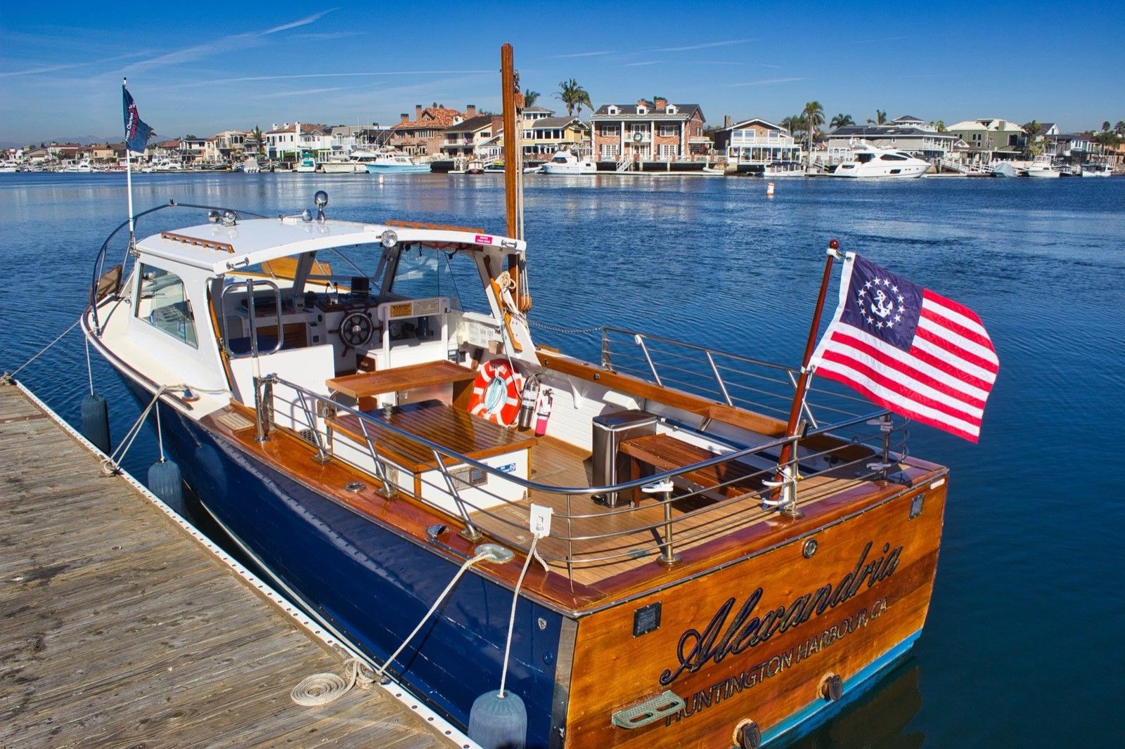 Alexandria, a classic wood boat with a teak interior, on Huntington Harbour